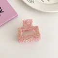 Detail of pink marble textured acetate claw clip with a square hollow design for women - Cherry Blossom Pink (Small Square Style)