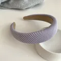 Lilac purple ribbed velvet padded headband with non-slip lining on a clean white surface - Purple