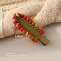 Macro detail of 6.8cm hand-woven colorful wool yarn crochet hair clip on olive metal base - Light Green