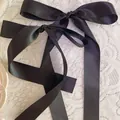 Elegant pair of black satin ribbon bows with long tails for ballet style hairstyles - Hair Clip / Black