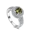 Macro detail of silver ring featuring a round green zircon stone with halo setting - US 6 / Green