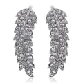 Detailed view of silver leaf-shaped crawlers with pavé set sparkling crystals on white - Silver