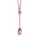 Macro detail of rose gold crown spoon pendant with delicate metal cross chain - Rose Gold