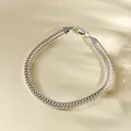 Macro shot of silver foxtail chain bracelet with wheat pattern and lobster clasp closure - Silver