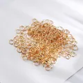 Primer plano de anillas abiertas doradas a granel para creación de joyas DIY y collares - Anilla de salto / 200 Piezas/Paquete (4mm) / Dorado