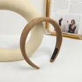 Brown suede thick sponge headband with Hand Made label in a minimalist setting - Coffee