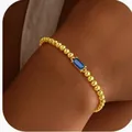 Bracelet élégant à perles dorées avec un zircon bleu rectangulaire porté au poignet - 14k / Or Septembre (Bleu Foncé)