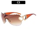 Lunettes de soleil Y2K punk avec monture orange et détails de cœur dorés - Branches Marron Verres Dégradés Marron