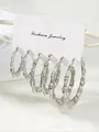 Detailed view of silver bamboo hoop earrings in three sizes on a fashion display card - 14k / Silver (3 Pairs Pack) (e1806)