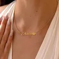 Close-up of personalized gold Ashley nameplate necklace with delicate daisy flower detail - Ashley Daisy Style (x686) / Gold