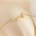 Detail of custom Angela name necklace with a daisy flower pendant in gold finish - Angela Hollow Daisy Style (x687) / Gold