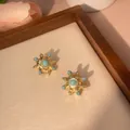 Detail of vintage turquoise sunburst earrings with gold plating and blue stone inlay - Eight-Pointed Star (e005)