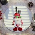 Christmas gnome cutlery holder with red stripes and white beard on a white plate - Gnome Style / Gnome With Plaid Hat