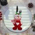 Festive snowman cutlery holder made of red and white fabric for Christmas table decor - Snowman Style / Snowman
