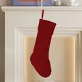 Classic deep red cable knit Christmas stocking with hanging loop on a fireplace - Red Rhombus Knit Stocking