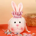 Plush bunny drawstring gift bag with long ears and pink checkered ruffle trim for Easter - Pink