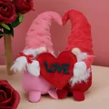 Set of pink and red Valentine's Day plush gnomes holding a large red felt LOVE heart decoration - Gnome Couple Set Holding Heart