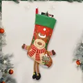 Red Christmas stocking with reindeer plush and Merry Christmas tag on green cuff - Printed Reindeer Long Leg Stocking