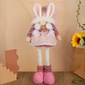 Pink Easter bunny gnome plush with telescopic legs and striped outfit for home decor - Pink Retractable Bunny