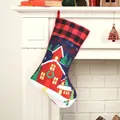 Blue Christmas stocking with reindeer sleigh scene and red-black checkered cuff - House Pattern