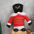 Gnome nutcracker soldier doll in red uniform sitting on a basket for Christmas decor - Soldier Sitting Position / Red