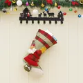 Green burlap Christmas stocking with Santa Claus and plaid tree festive decoration - Santa Claus