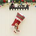Knitted Christmas stocking with 3D snowman doll and snowflake embroidery on fireplace - Snowman