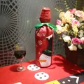 Christmas snowman wine bottle cover with Let it Snow lettering and green ribbon bow decoration - Snowman
