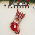 Christmas stocking with 3D snowman and plaid design hanging on a rustic wooden wall - Snowman