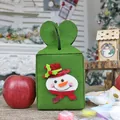 Green Christmas felt gift bag with snowman patch and heart-shaped handle for apples - Snowman
