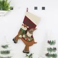 Christmas stocking with plush reindeer and Santa figures in red and cream fabric - Santa Claus