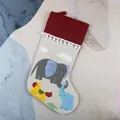 Cream linen Christmas stocking with plush red cuff and elephant applique embroidery - Elephant Style