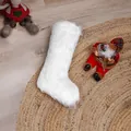 White faux fur Christmas stocking on a rustic braided rug for holiday gift decoration - White Plush Stocking