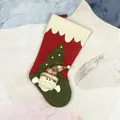 Christmas stocking with plush Santa and tree on red and green fleece fabric - Santa Claus