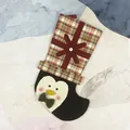 Christmas stocking with penguin design and red-green plaid cuff for holiday decor - Penguin Style