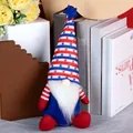 Patriotic July 4th gnome plush with stars and stripes hat on cozy home background - Independence Day Seated Gnome Style B