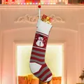 Knitted Christmas stocking with snowman motif in red and grey stripes for festive decor - Snowman