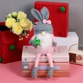 Pink Easter gnome plush with rabbit ears hat and white beard holding green plant decor - Gray Hat (CX23204)