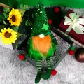 St. Patrick's Day gnome doll with green sequin hat and long orange beard on grey rug - Sequin Style (CX23314)