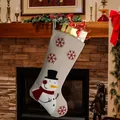 Hessian Christmas stocking with red snowflake embroidery and 3D snowman on a fireplace - Snowman