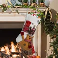 Christmas stocking with 3D reindeer and snowman decorations by a cozy fireplace - Elk Style