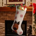 Christmas stocking featuring reindeer embroidery and red snowflakes for holiday decor - Elk