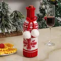 Knitted red and white wine bottle cover with snowflake pattern and fluffy white pom-poms - Snowflake Style / Burgundy