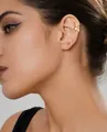 Macro shot of three gold ear cuffs featuring twisted designs and zircon pavé detailing - Fashion Twisted Minimalist Style (e398) / 14k / Three-Piece Set / Gold