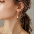 Fashionable 18k gold plated brass earrings with pearls and crystals on a model - Thin Chain Artificial Pearl Rhinestone Connection Style (e413) / 14k Gold Plated / One Pair / Gold