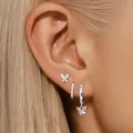 Silver brass butterfly earrings set with sparkling cubic zirconia on model's ear - Silver Tone Butterfly Set (e834)