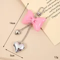 Pink bow keychain with silver heart charms and metal chains in Y2K aesthetic style - Gate Buckle Style / Korean Pink