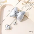 Silver puffed bow bag charm with heart pendants in a minimalist y2k aesthetic - Small Rope Head Style / Silver