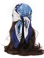 Detail view of navy blue silk-like headscarf with geometric dots on long brown hair - Patchwork Floral - Blue
