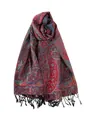 Dettaglio del tessuto jacquard paisley rosso con trama morbida e nappe nere eleganti - Nero Rosso
